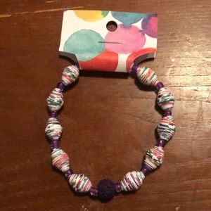 A bracelet for all with fun colors and handmade hardened paper beads